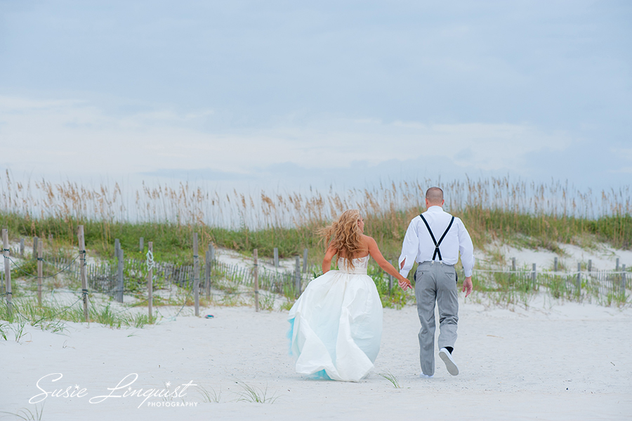 bride and groom beach exit